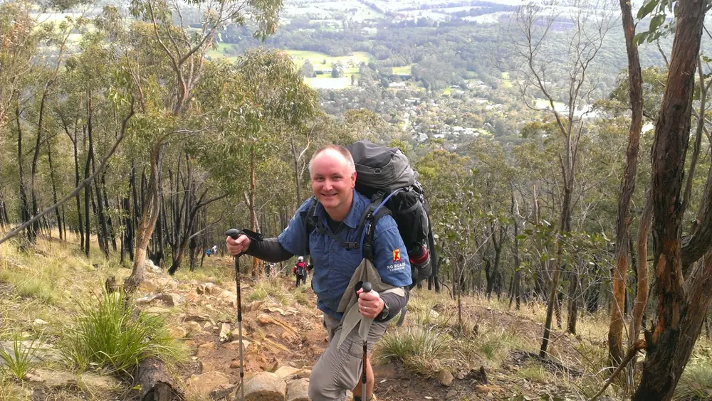 A hiker training with a pack