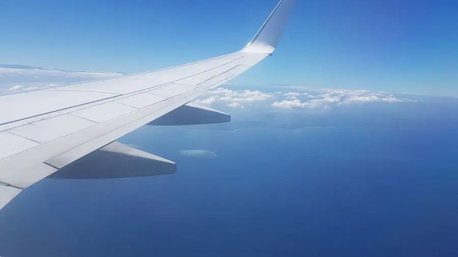 Aircraft wing over cloud